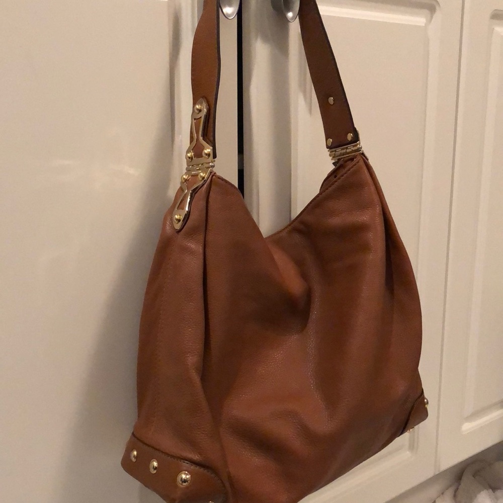 Michael Kohrs brown leather shoulder bag. (Flaw)